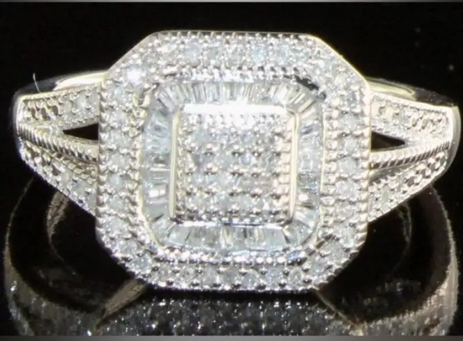 Diamond ring with a large central gemstone and smaller diamonds on a black background