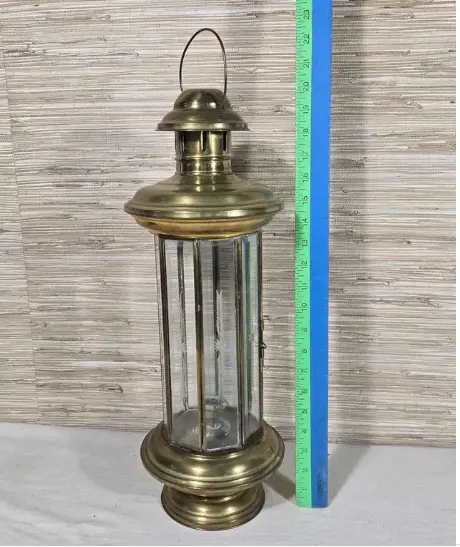 Brass glass enclosed candle holder